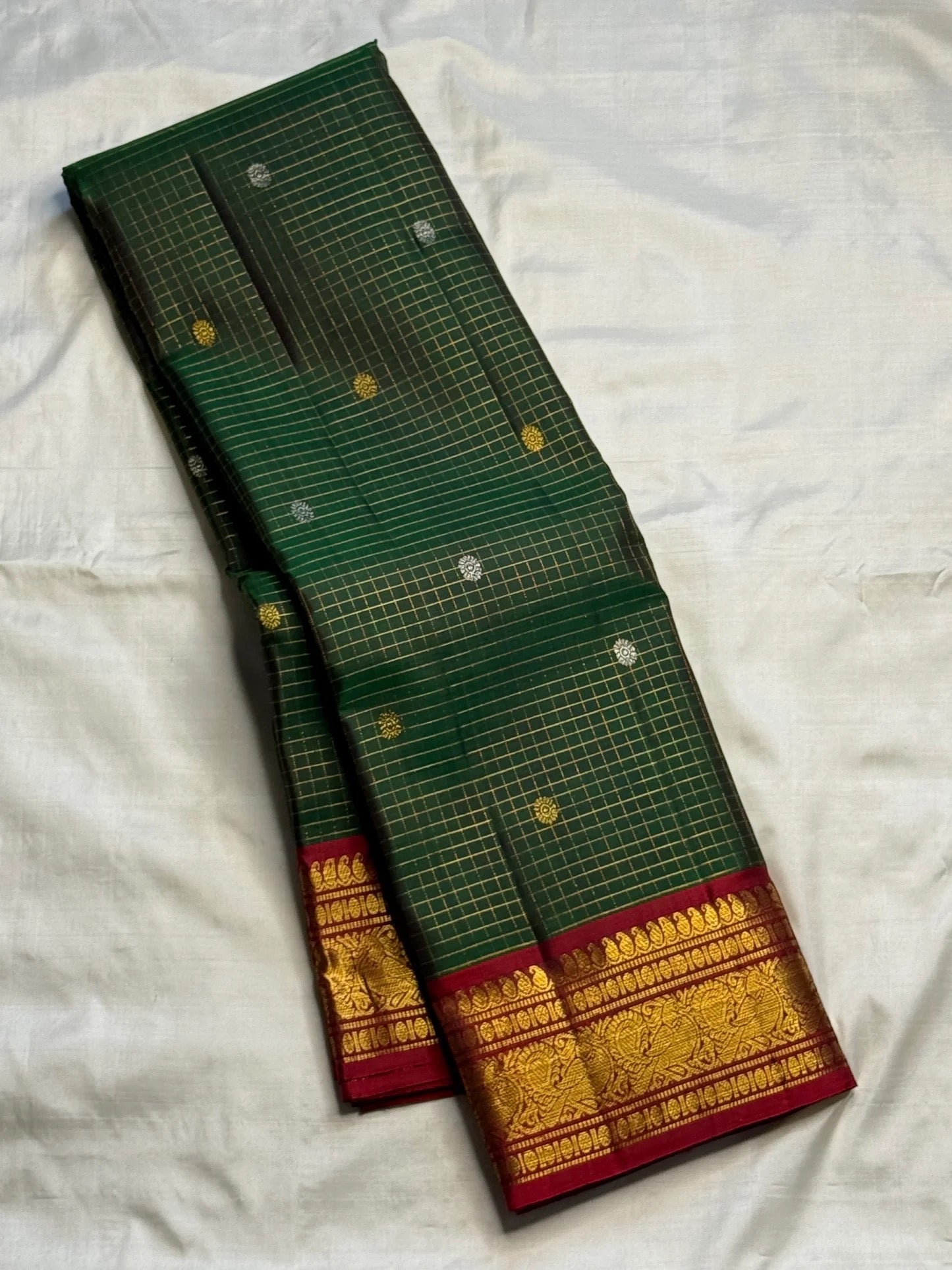 Deep Forest Green pure silk Kanjivaram Zari Kattam saree with Arakku Red pallu.
