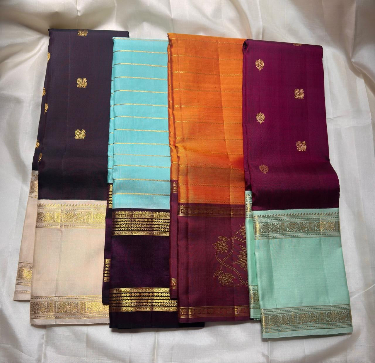 Raspberry Magenta pure silk Kanchipuram saree, Rettapet weave with Pastel Aqua Mint border — folded view