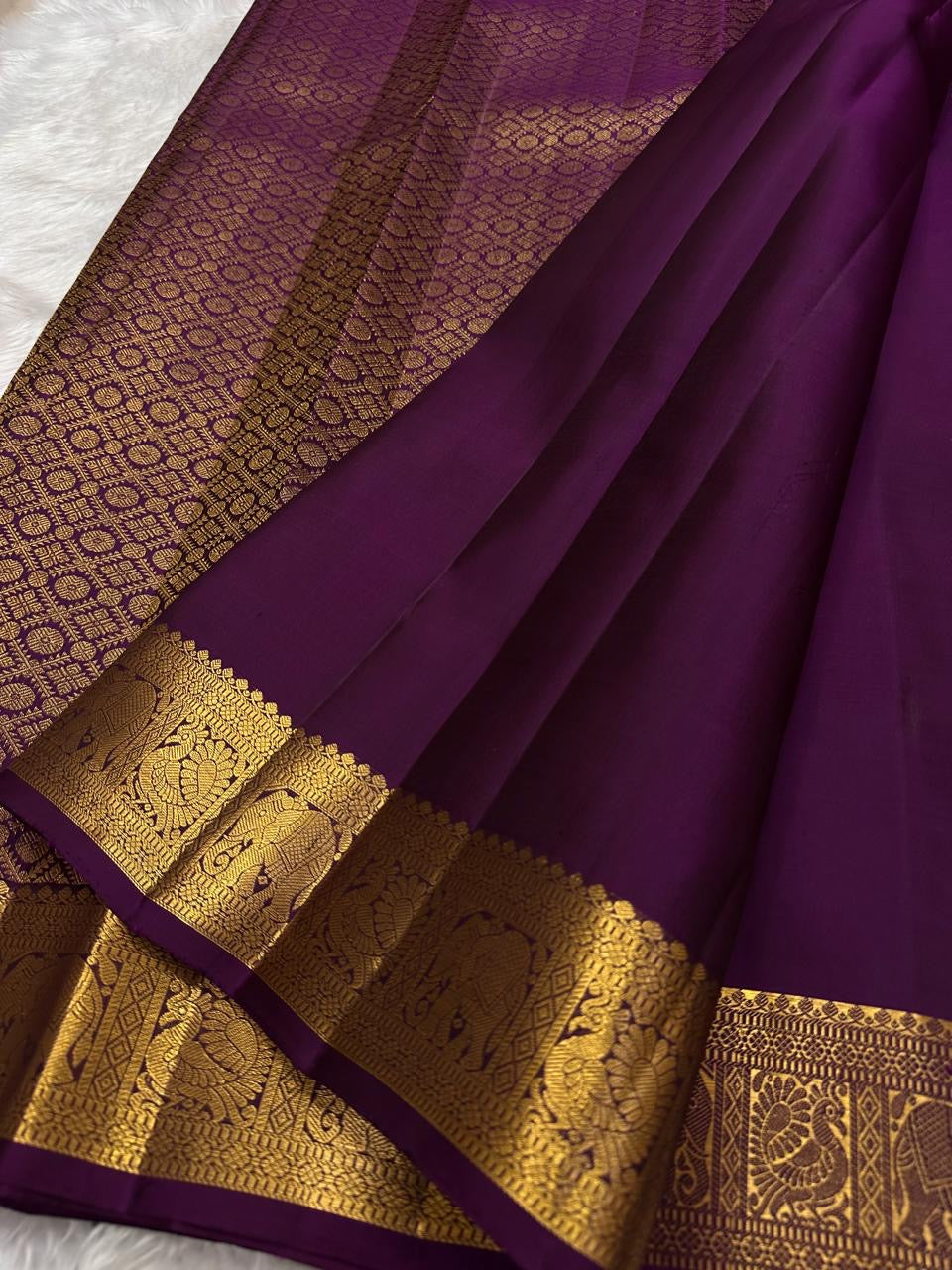 Handwoven pure silk Kancheepuram saree in deep grape purple with Maanga paisley Mayil butta and ornate antique gold zari border Silk Mark certified