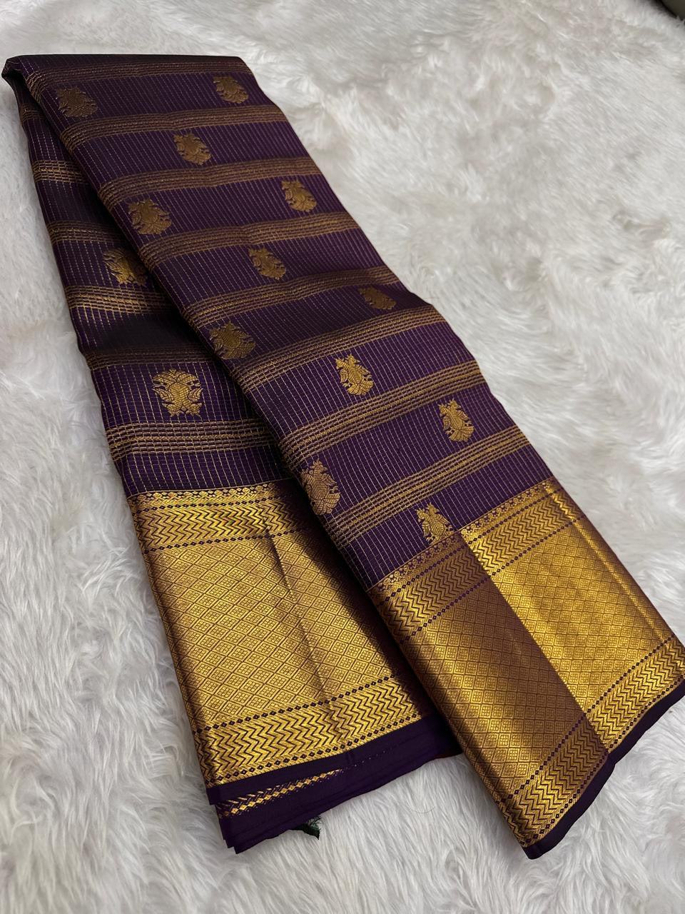 Thick Varisaipet border in dense gold zari on deep grape purple Kanchi Pattu saree