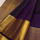 Folded view of deep grape purple pure silk Zari Kattam Kanchi Pattu saree with Gandaberunda Butta