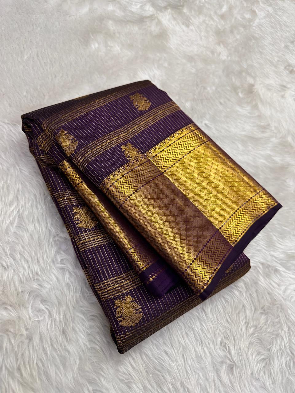 Close view of Zari Kattam body showing fine gold grid and Gandaberunda Butta on deep grape purple silk