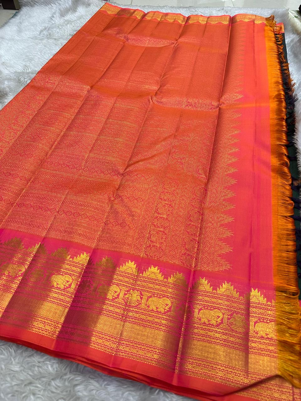 Deep Forest Green Handwoven Pure Silk Kanjeevaram Saree with Gandaberunda Zari Buttas and Rani Pink Border