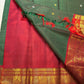 Close view of antique-gold traditional zari motifs on the Zari Kattam border.