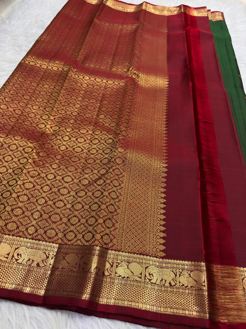 Deep Green handwoven Pure Silk Kanchipuram saree showing the full body and contrast zari border.