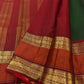 Close-up of the green silk surface and woven zari work on this Kanchipuram saree.