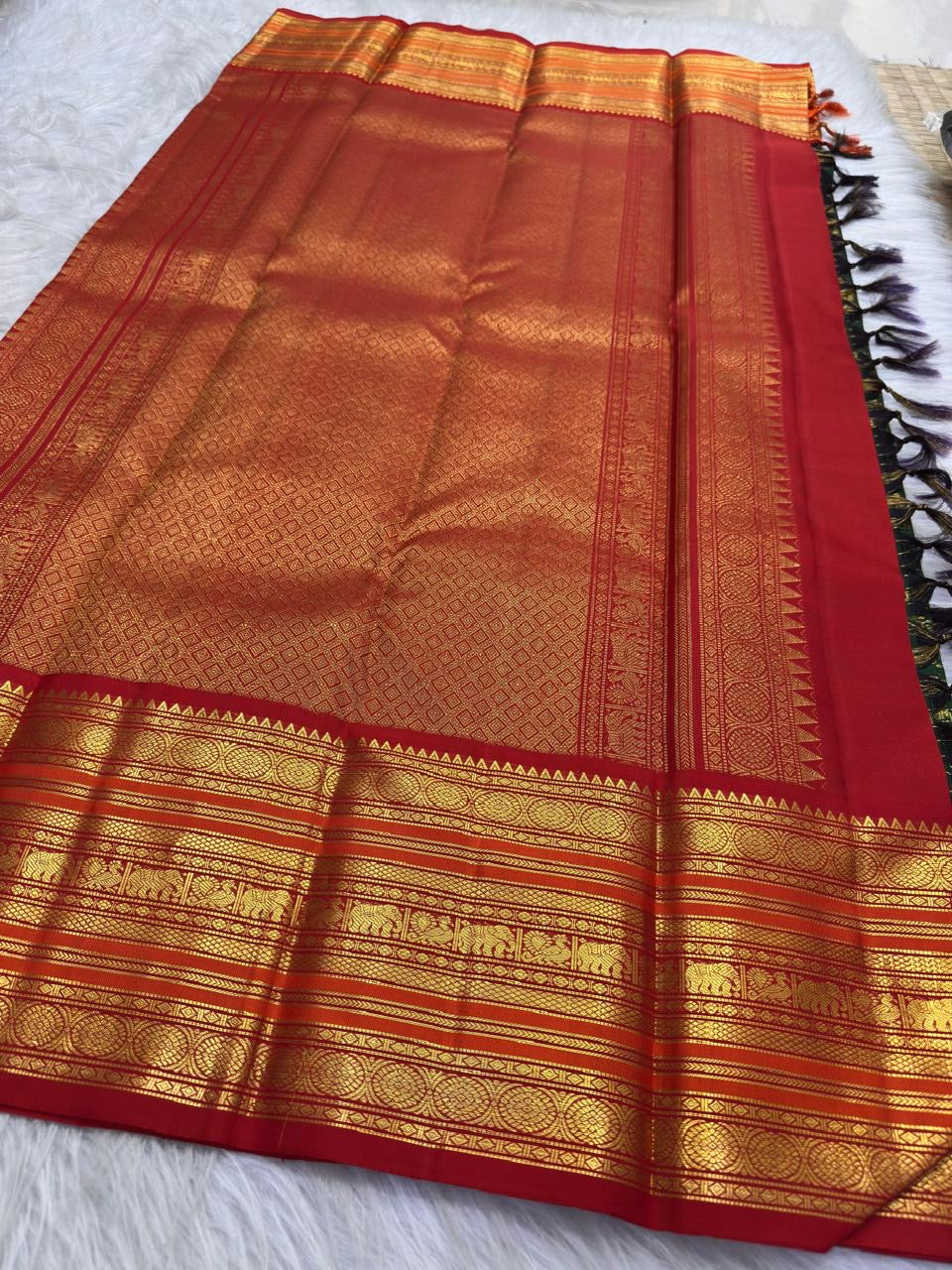 Handwoven Pure Silk Kanchipuram saree with Varisaipet construction and warm gold zari detailing.