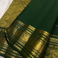 Handwoven peacock motifs in gold zari border on Deep Forest Green Kanjeevaram saree