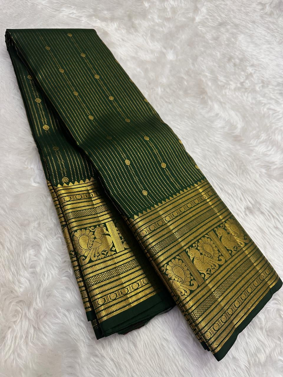 Mayil and Kodi gold zari work on Deep Forest Green Pure Silk Kanchipuram pallu