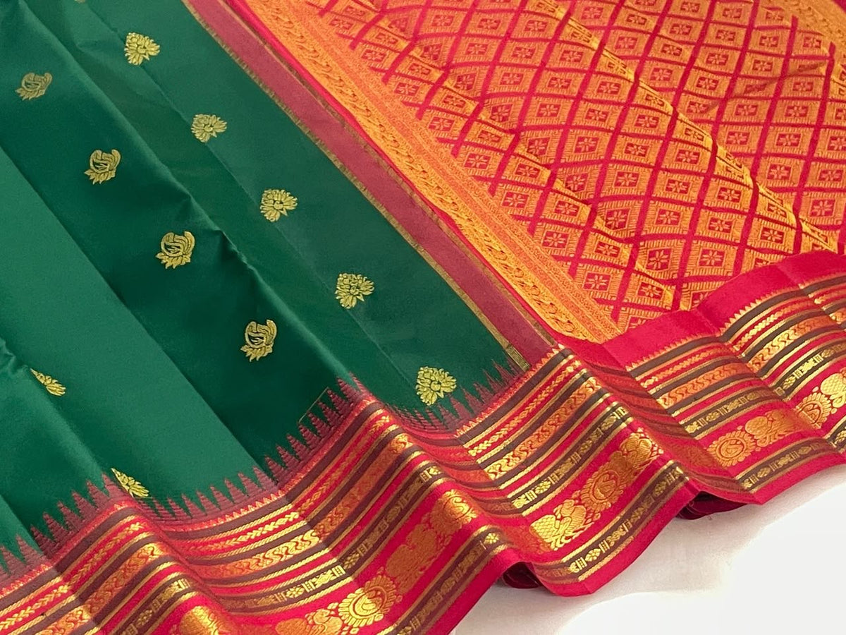 Deep Green Kanjivaram silk saree with Mayil and floral gold zari buttas