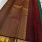Deep Green Kanjivaram silk saree with fine zari checks and Maanga Buttas
