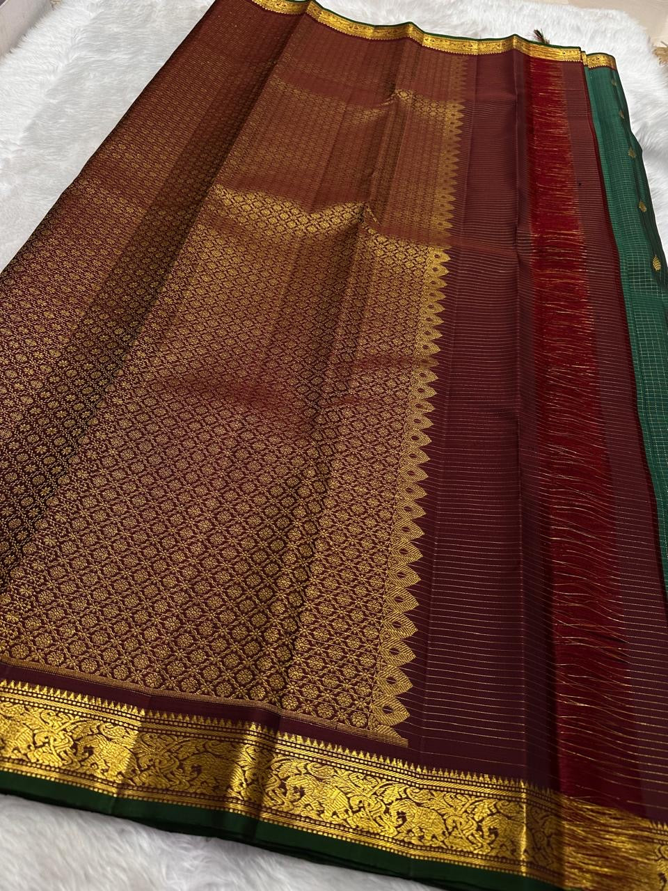 Deep Green Kanjivaram silk saree with fine zari checks and Maanga Buttas
