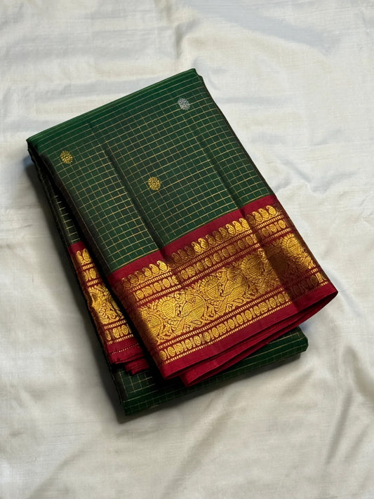 Deep Forest Green Kanchipuram silk saree with fine intersecting zari Kattam grid.