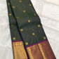 Deep Green Kanchipuram silk saree with rich Magenta pallu