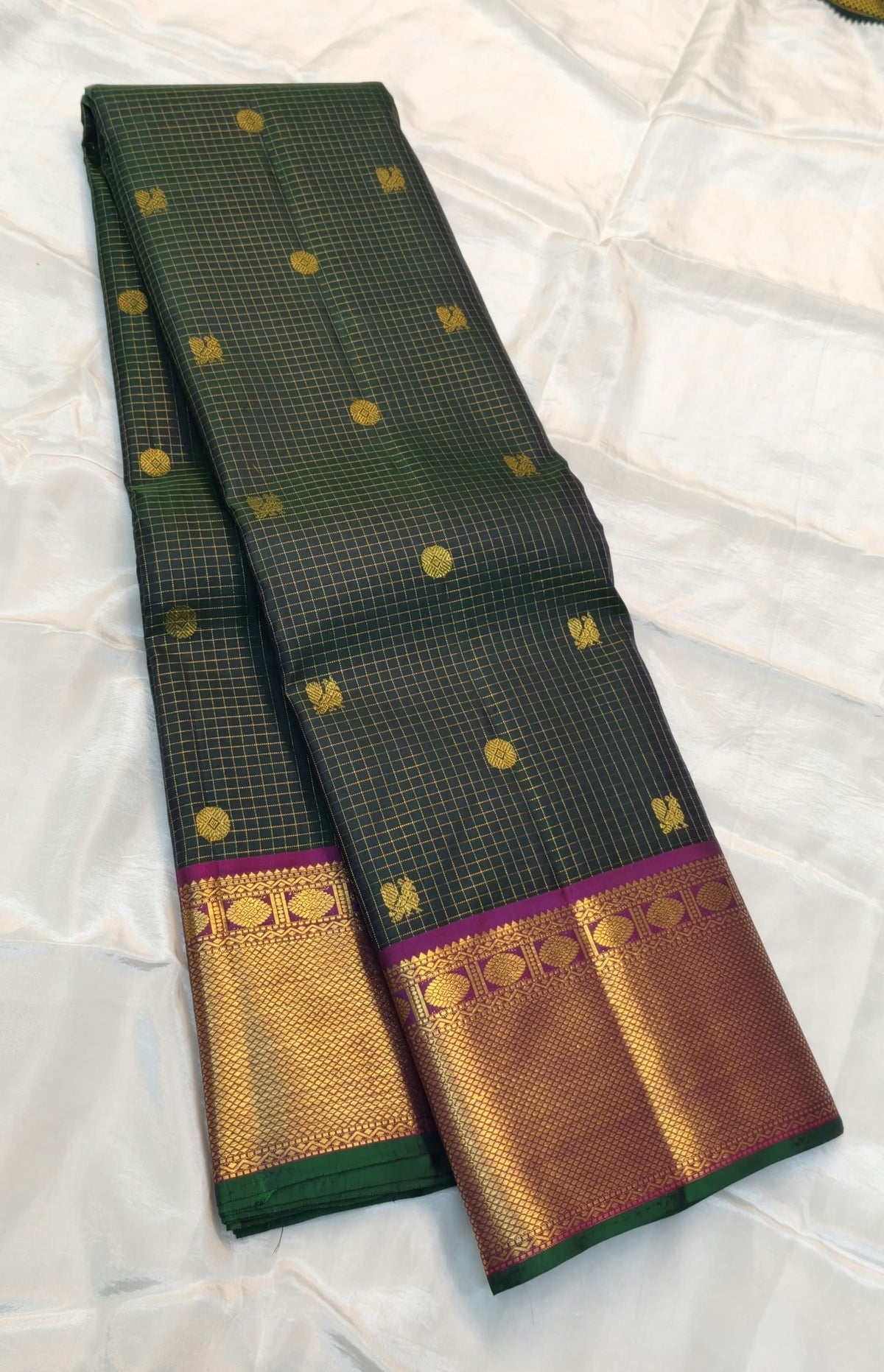 Deep Green Kanchipuram silk saree with rich Magenta pallu