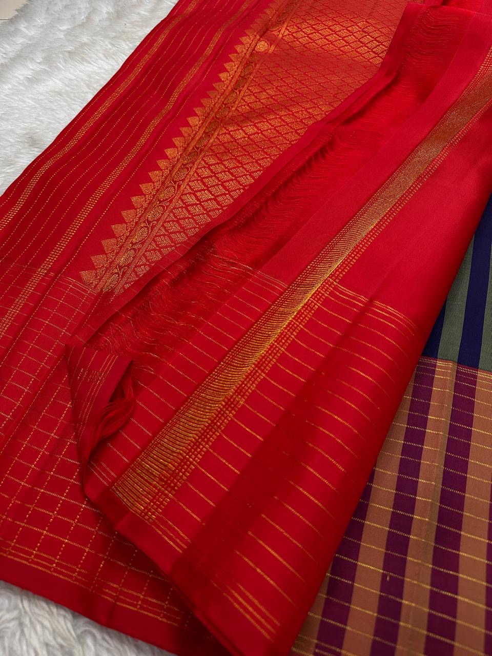 Deep indigo and vermilion Pure Silk Kanchipuram saree with fine zari stripes