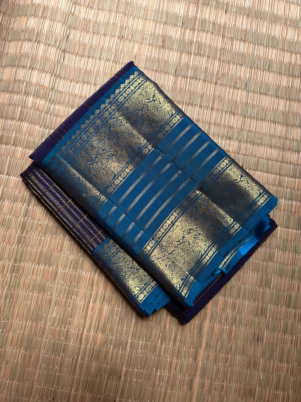 Deep Indigo Handwoven Pure Silk Kancheepuram Zari Kattam Saree with Peacock Blue Zari Border – silk fabric close-up