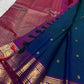 Deep Kadal Neelam Blue Pure Silk Kanchipuram Butta saree with gold buttas and Vadamalli zari border.