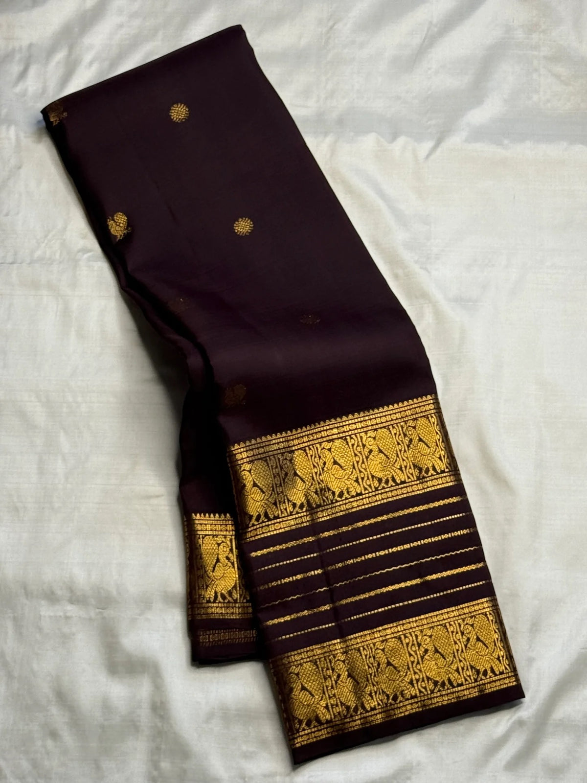Deep Kanchana Brown pure silk Kanjivaram Varisaipet saree with radiant warm gold zari border.