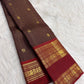 Deep Kanchana Brown pure silk Kanjivaram Zari Kattam saree with Arakku Red and antique-gold Mayil border.