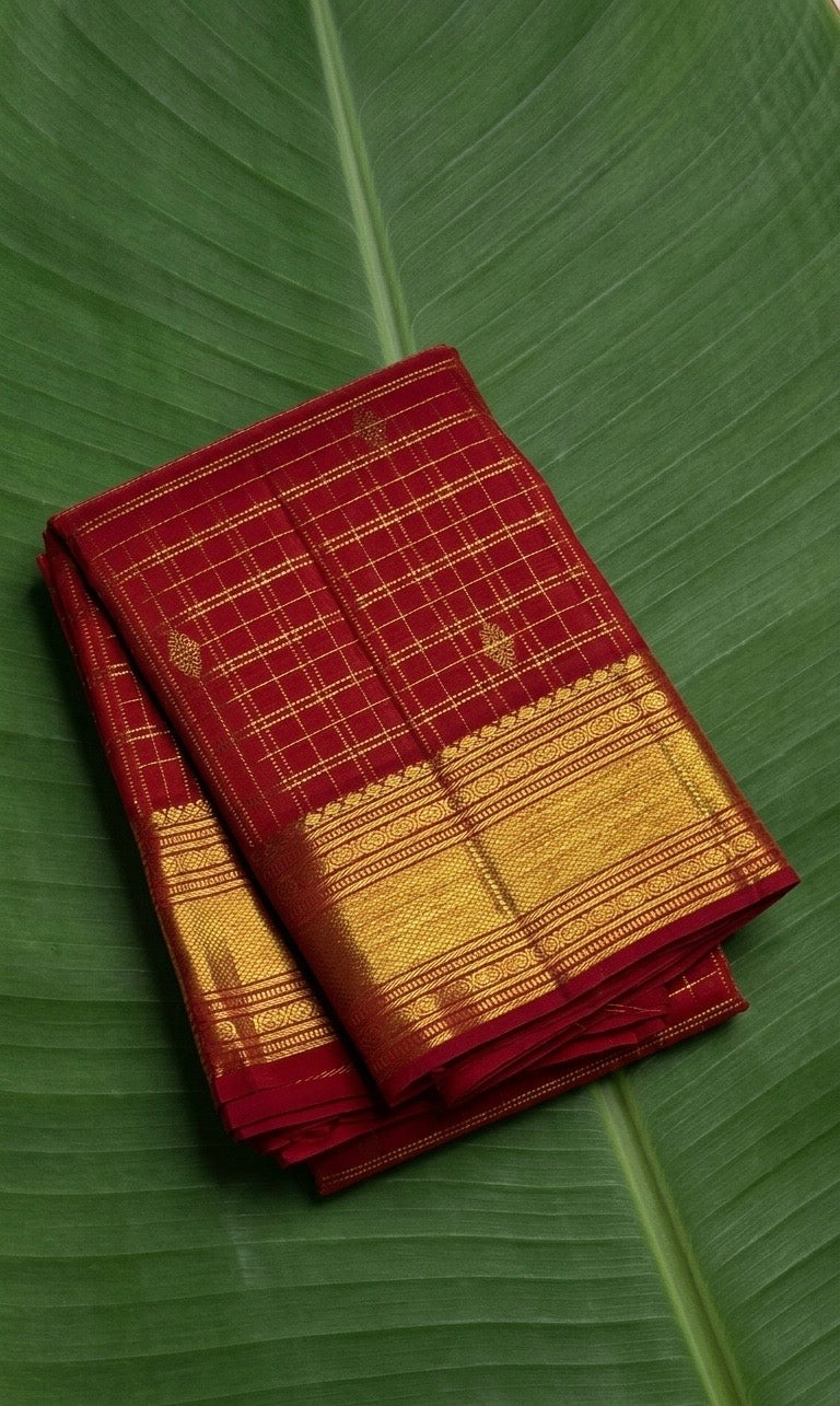 Deep kumkum red Kanchipuram silk saree with antique gold zari kattam checks and rich traditional border