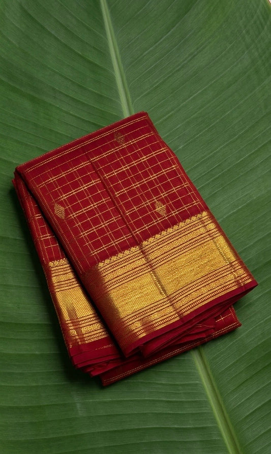 Deep kumkum red Kanchipuram silk saree with antique gold zari kattam checks and rich traditional border