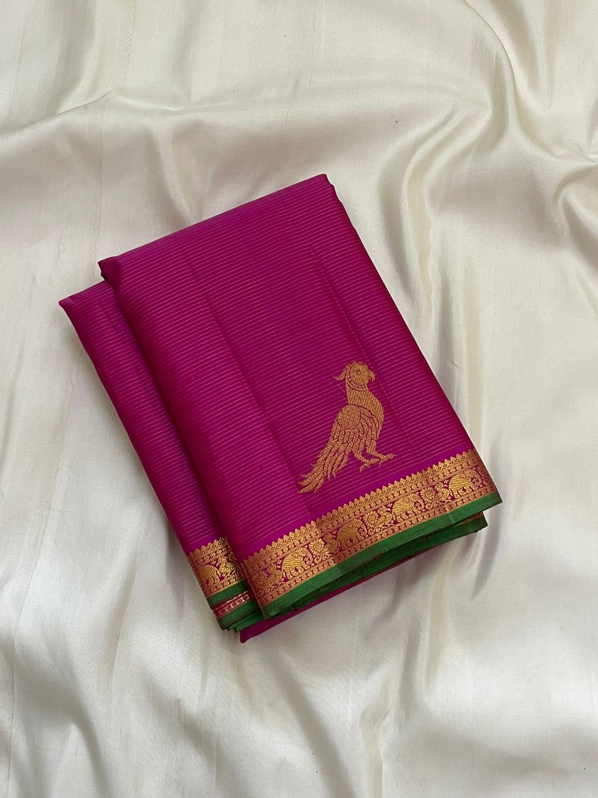 Handwoven deep magenta Kanchi Pattu pure silk saree with fine Vairaoosi zari shimmer body and contrast forest green border