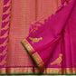 Ornate peacock Kili Butta gold zari pallu of deep magenta Kanchi Pattu saree on green ground