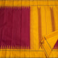 Deep arakku red and canary yellow Kancheepuram silk saree folded showing Pattupet body and contrast canary yellow Korvai border