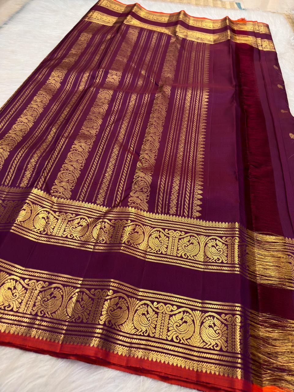Fuchsia Kanchi Pattu Rettapet saree with narrow warm red selvedge