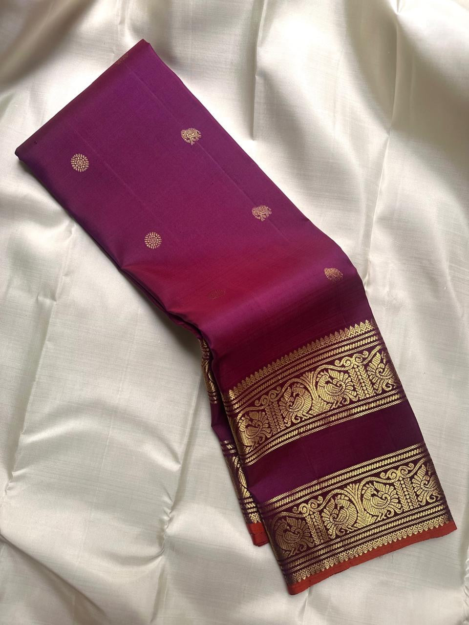 Fuchsia Pure Silk Kanchi Pattu Rettapet saree with peacock archway zari border