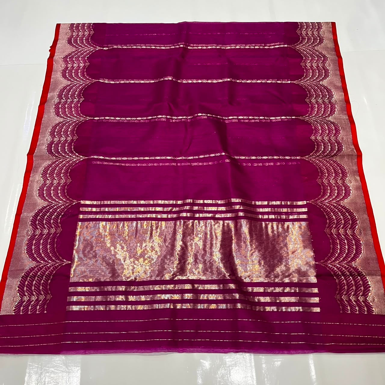 Deep magenta Katan Silk Chanderi saree body close-up showing dashed gold pinstripes