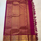 Full pallu view of the Deep Magenta zari pallu with dense woven gold detailing and contrast edge