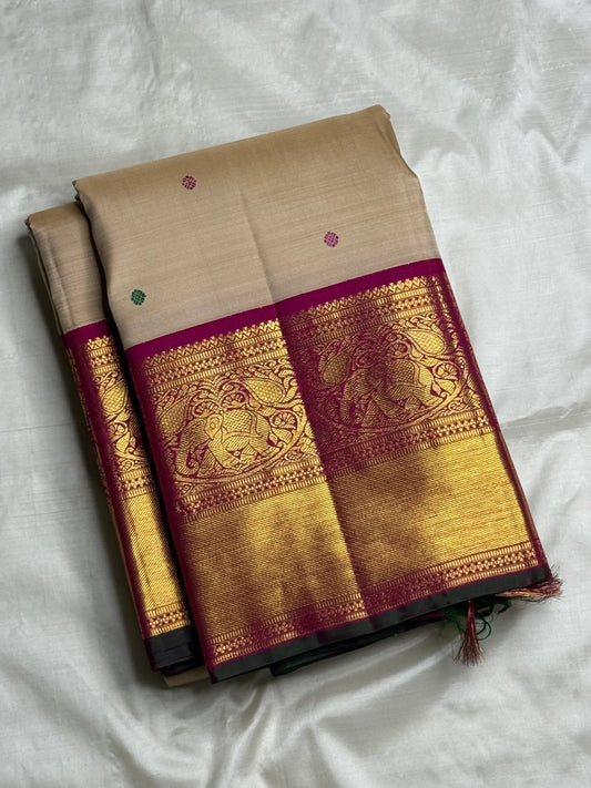 Detailed view of the zari border with elephant motifs on the Deep Magenta Korvai border