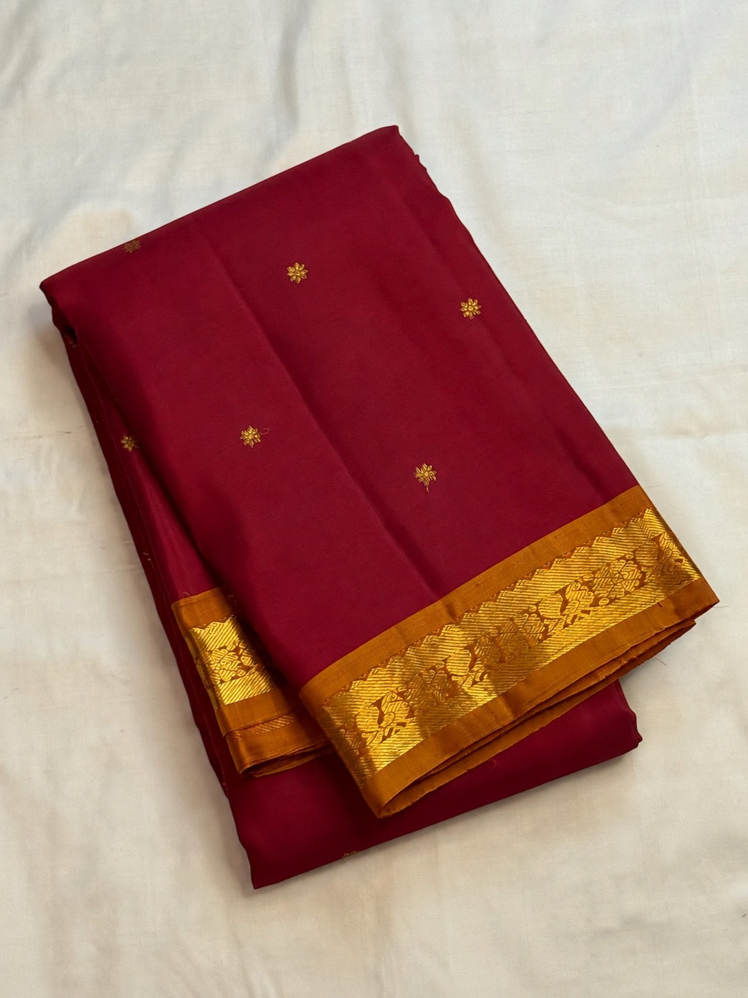 Deep magenta red Pure Silk Kanjivaram Butta saree with copper gold zari border, detail view 4