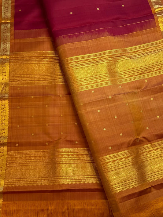Deep magenta red Pure Silk Kanjivaram Butta saree with copper gold zari border