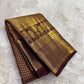 Handwoven maroon brown Kanchipuram silk with grand traditional elephant zari border.