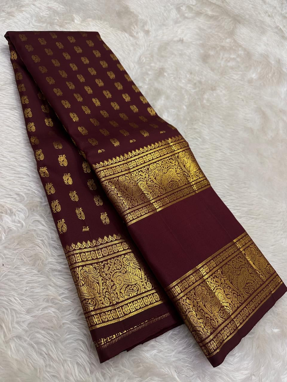 Deep maroon Kanjipuram silk saree with ambari yaanai butta and bottle green pallu — Idam Living