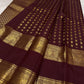 Deep maroon Kanjipuram silk body close-up showing ambari yaanai elephant butta motifs
