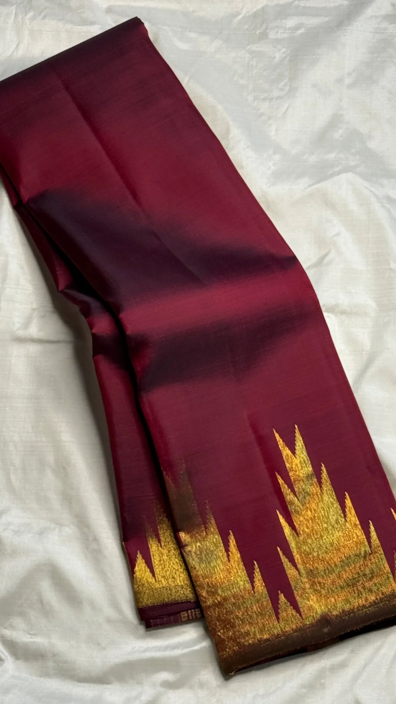 Deep maroon Ettukol Kanjivaram silk saree, draped view