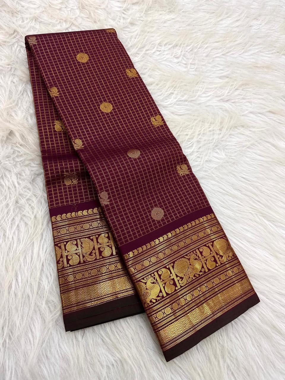 Maroon Kanchipuram saree with Mayil zari border