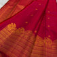 Deep Maroon Kanjivaram silk saree body close-up with gold zari floral butta motifs