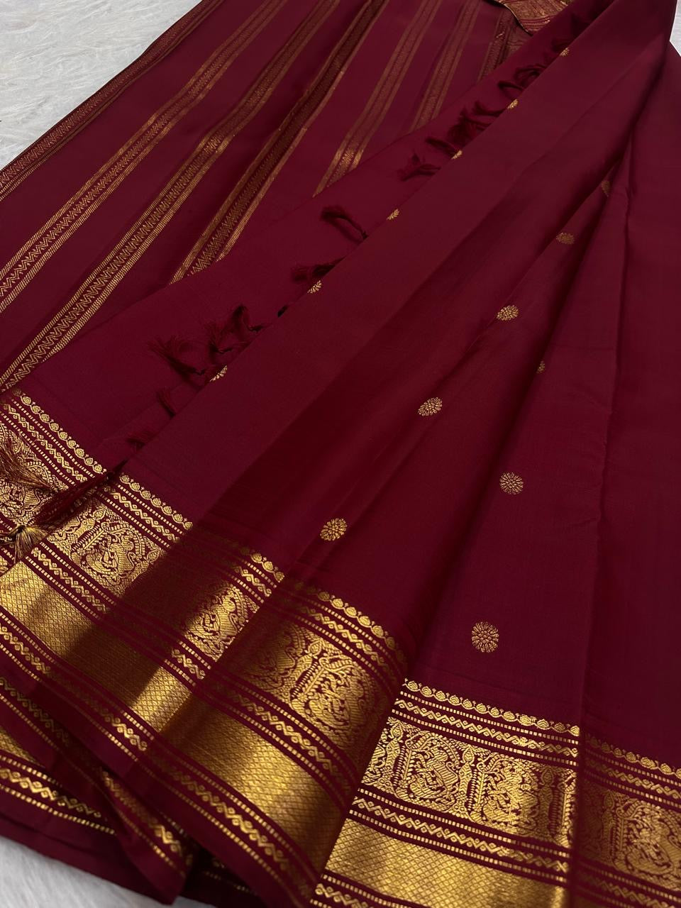 Deep Maroon Kanchipuram silk saree with dense Poo-Kodi traditional gold zari weaving