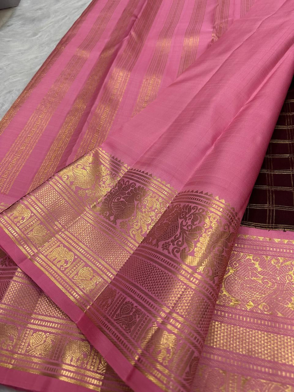 Deep maroon Pure Silk Kanchipuram with fine Zari Kattam checks.