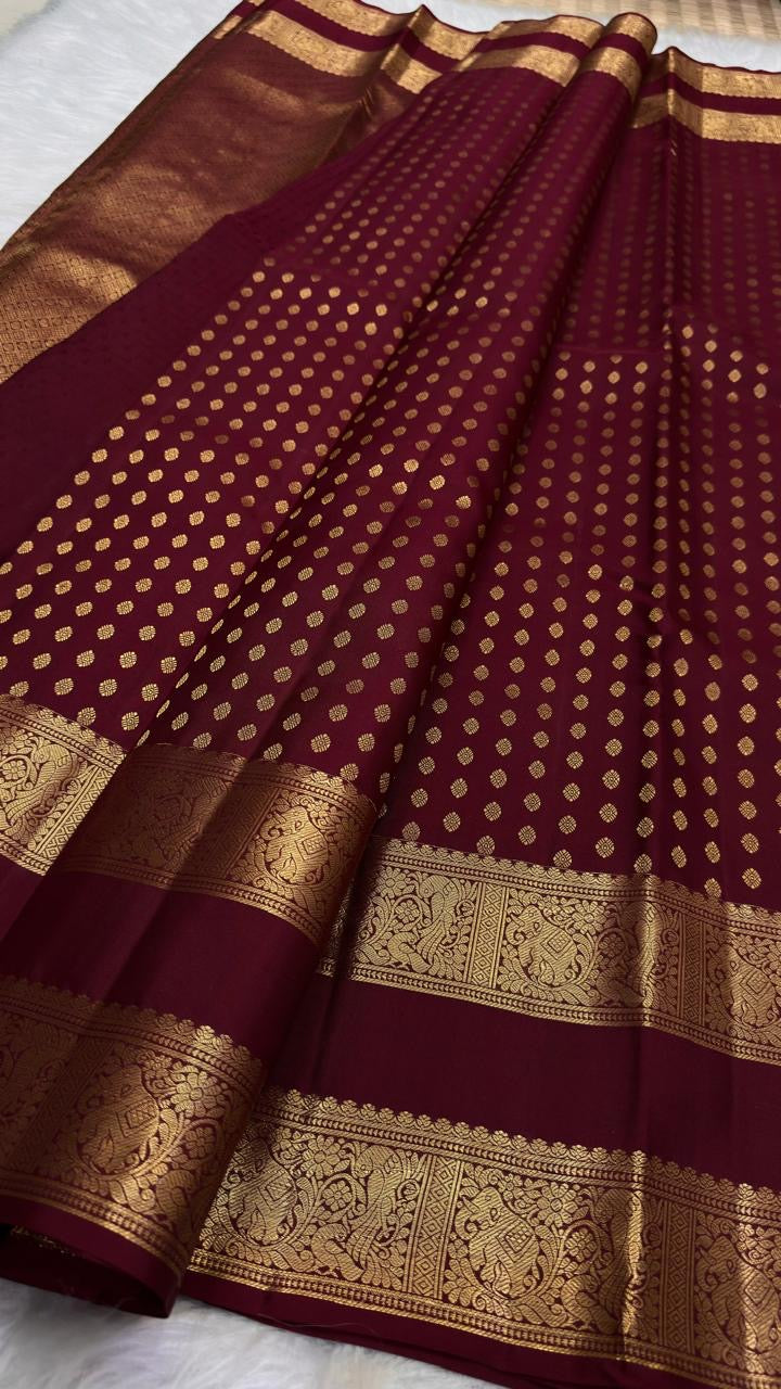 Deep maroon Kanjivaram saree with traditional zari border