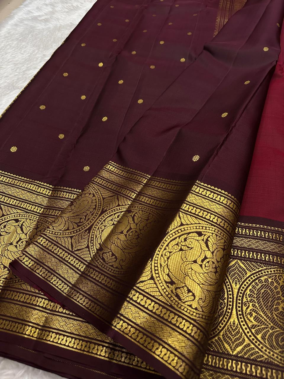 Deep maroon korvai Kancheevaram silk saree – folded view