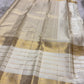 Warm Ivory Kanjivaram pallu with dense antique-gold geometric and ornamental weaving.