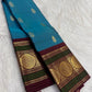 Deep Maroon Kanchipuram border with Peacock Green bands and gold lotus medallions