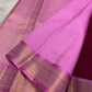 Bright pink silk saree with a broad traditional zari border