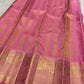 Deep maroon Pure Silk Kanchipuram saree with a broad pink zari border.